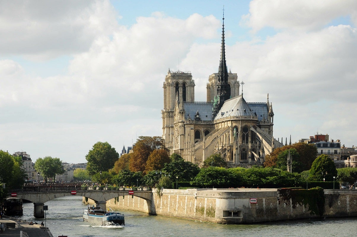 Paris, Ille de France, France. September 16, 2024: Notre Dame Cathedral overlooking the Seine River in Paris, France.